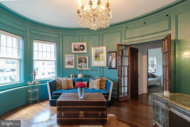 1901 Wyoming Ave NW Unit 40, Washington, DC 20009 - living area featuring a chandelier, a decorative wall, and wood finished floors