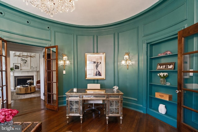 1901 Wyoming Ave NW Unit 40, Washington, DC 20009 - office with built in features, a decorative wall, dark wood finished floors, a chandelier, and french doors