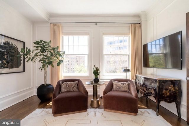1901 Wyoming Ave NW Unit 40, Washington, DC 20009 - living area featuring wood finished floors, a decorative wall, and crown molding