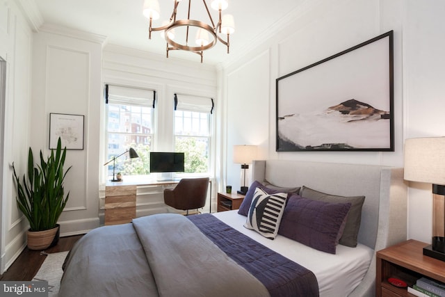 1901 Wyoming Ave NW Unit 40, Washington, DC 20009 - bedroom featuring crown molding, wood finished floors, a chandelier, and baseboards