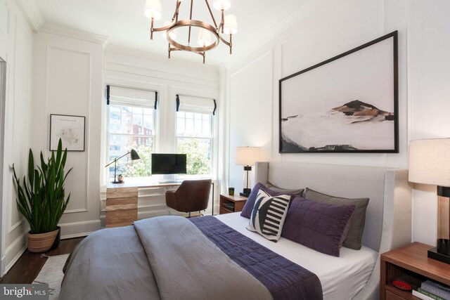 1901 Wyoming Ave NW Unit 40, Washington, DC 20009 - bedroom featuring ornamental molding, wood finished floors, a chandelier, baseboards, and a desk