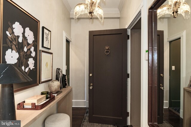 1901 Wyoming Ave NW Unit 40, Washington, DC 20009 - entryway featuring a chandelier, dark wood-type flooring, ornamental molding, and baseboards