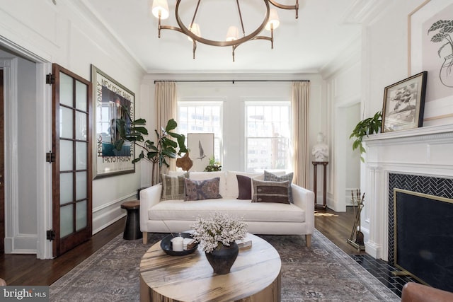 1901 Wyoming Ave NW Unit 40, Washington, DC 20009 - living area with ornamental molding, wood finished floors, a chandelier, and a fireplace with flush hearth