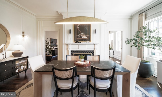 1901 Wyoming Ave NW Unit 40, Washington, DC 20009 - dining area with a tile fireplace, wood finished floors, and ornamental molding