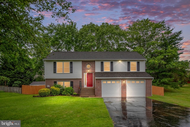 22 Buck Rd, Stafford, VA 22556 - bi-level home featuring driveway, a garage, and brick siding