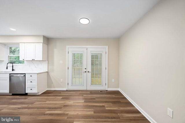 22 Buck Rd, Stafford, VA 22556 - kitchen featuring stainless steel dishwasher, a sink, french doors, dark wood-style flooring, and white cabinetry