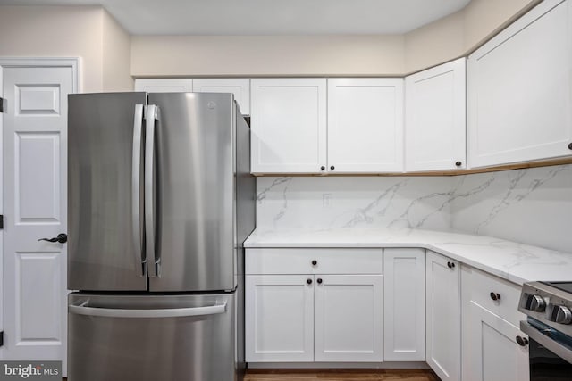 22 Buck Rd, Stafford, VA 22556 - kitchen featuring appliances with stainless steel finishes, white cabinetry, light stone countertops, and tasteful backsplash