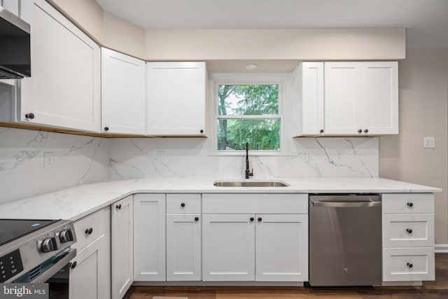 22 Buck Rd, Stafford, VA 22556 - kitchen with appliances with stainless steel finishes, a sink, backsplash, and white cabinets