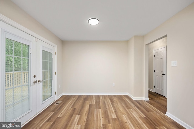 22 Buck Rd, Stafford, VA 22556 - empty room featuring baseboards, wood finished floors, and french doors