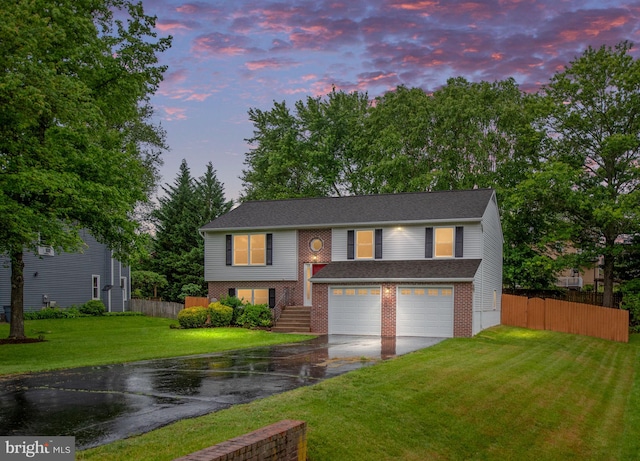 22 Buck Rd, Stafford, VA 22556 - split foyer home with driveway, an attached garage, and brick siding