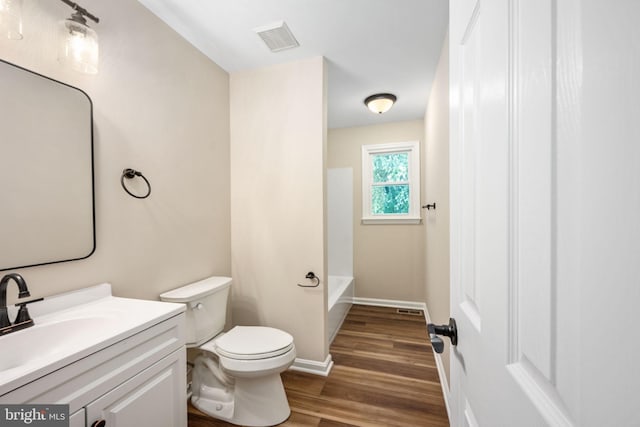 22 Buck Rd, Stafford, VA 22556 - full bath featuring toilet, vanity, wood finished floors, a bathtub, and baseboards