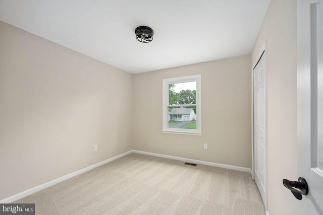 22 Buck Rd, Stafford, VA 22556 - unfurnished bedroom featuring light colored carpet, baseboards, and a closet