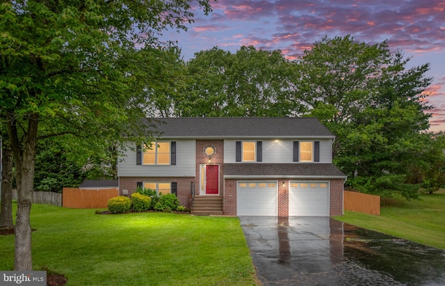 22 Buck Rd, Stafford, VA 22556 - raised ranch with a garage, driveway, and brick siding