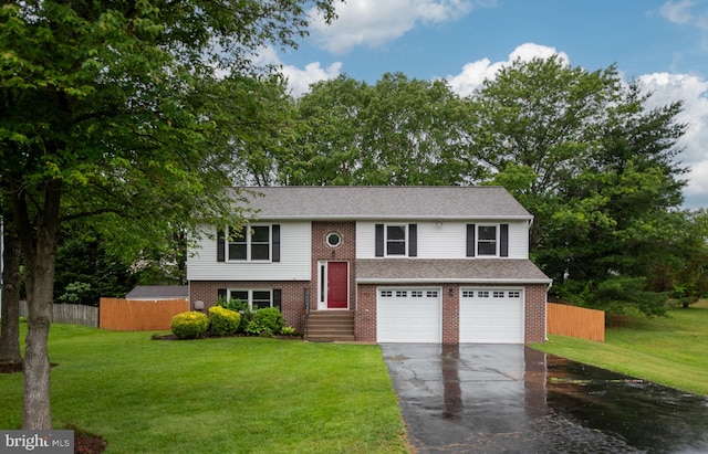 22 Buck Rd, Stafford, VA 22556 - split foyer home with driveway, an attached garage, and brick siding
