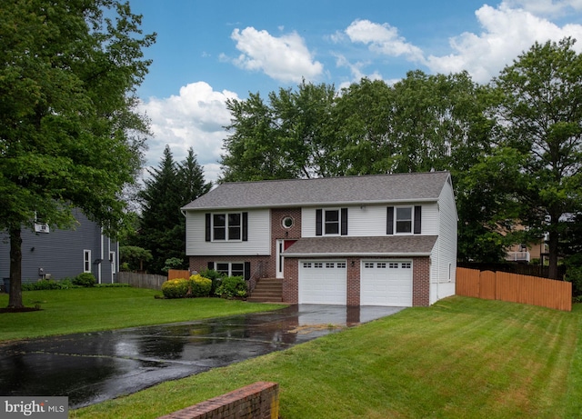 22 Buck Rd, Stafford, VA 22556 - raised ranch with driveway, a garage, and brick siding