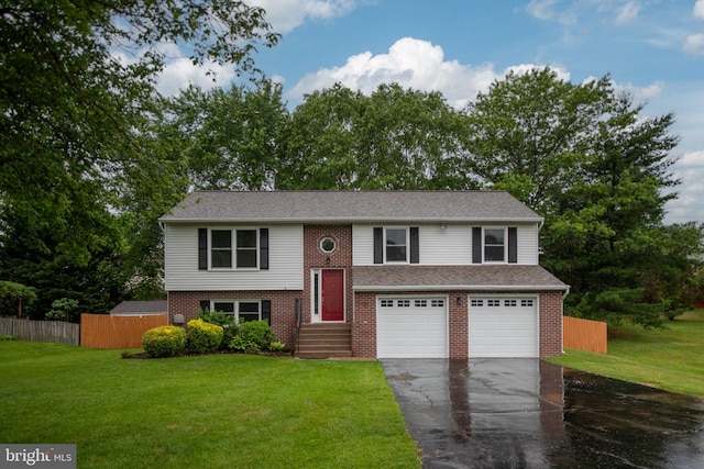 22 Buck Rd, Stafford, VA 22556 - split foyer home with driveway, an attached garage, and brick siding