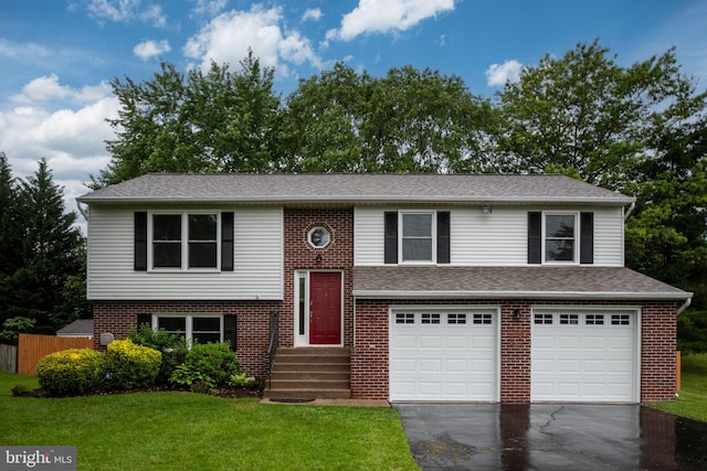 22 Buck Rd, Stafford, VA 22556 - split foyer home featuring asphalt driveway, a garage, and brick siding