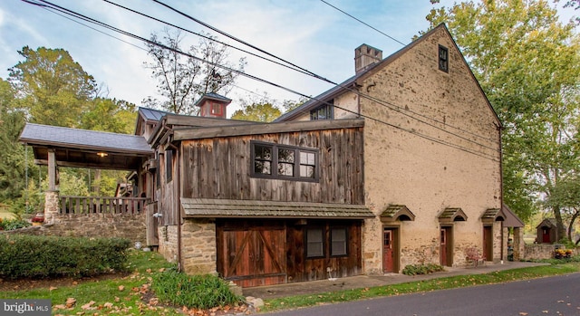 2855 Ash Mill Rd, Doylestown, PA 18902 - view of property exterior with a chimney and stone siding