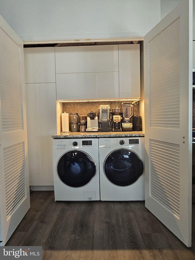 1211 S Eads St Unit 1701, Arlington, VA 22202 - washroom featuring washer and dryer and dark wood-style floors
