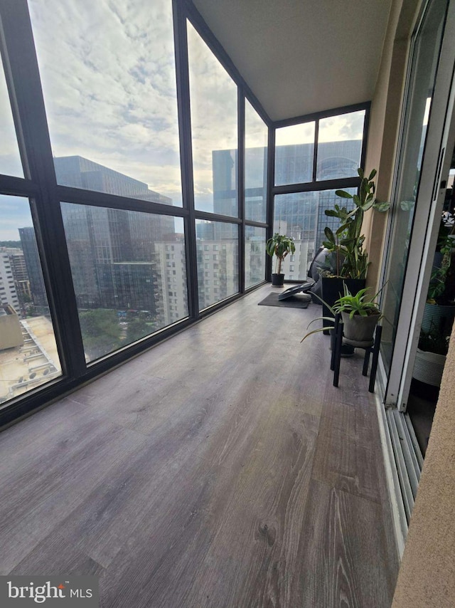 1211 S Eads St Unit 1701, Arlington, VA 22202 - sunroom with a wall of windows, wood finished floors, and a city view