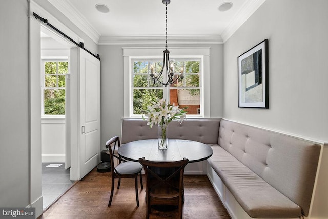 1601 E Ave, Mclean, VA 22101 - dining area featuring healthy amount of natural light, a barn door, a chandelier, wood finished floors, and ornamental molding