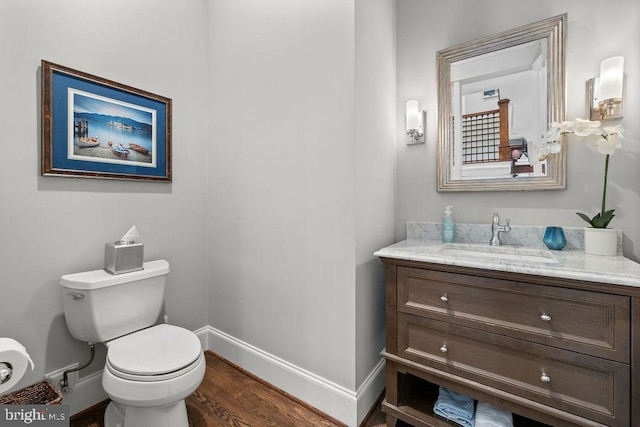 1601 E Ave, Mclean, VA 22101 - bathroom with toilet, wood finished floors, baseboards, and vanity