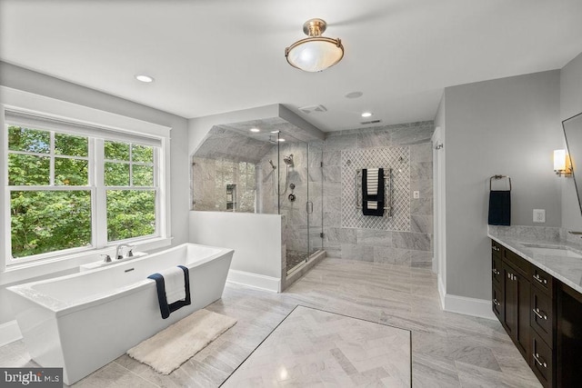 1601 E Ave, Mclean, VA 22101 - bathroom featuring a freestanding tub, a shower stall, vanity, marble finish flooring, and baseboards