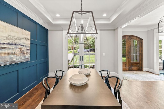 1601 E Ave, Mclean, VA 22101 - dining space with dark wood finished floors, french doors, a chandelier, crown molding, and a tray ceiling