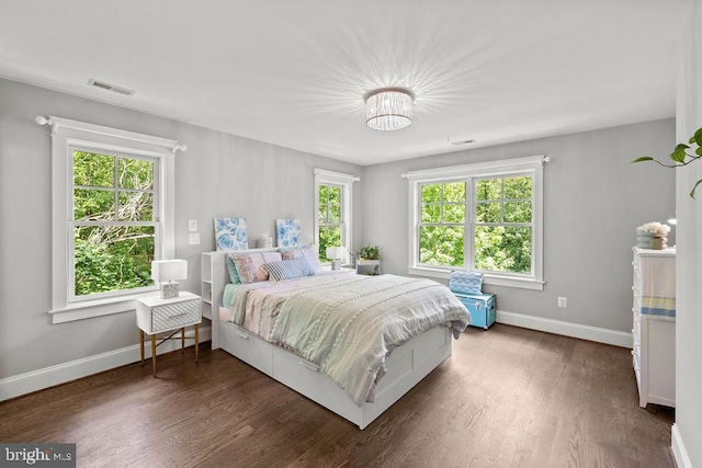 1601 E Ave, Mclean, VA 22101 - bedroom with baseboards, wood finished floors, and multiple windows