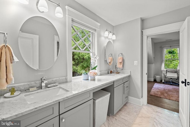 1601 E Ave, Mclean, VA 22101 - bathroom with marble look tile flooring, double vanity, and plenty of natural light
