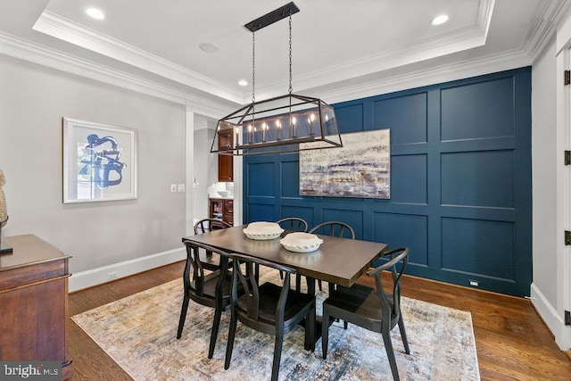 1601 E Ave, Mclean, VA 22101 - dining room featuring a raised ceiling, a decorative wall, a chandelier, dark wood-style flooring, and ornamental molding