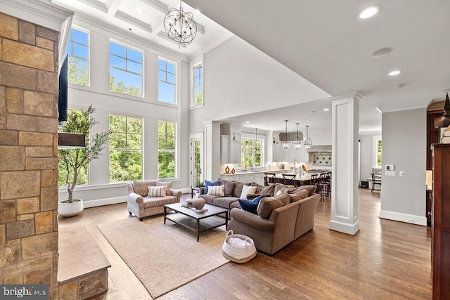 1601 E Ave, Mclean, VA 22101 - living area featuring a chandelier, ornamental molding, recessed lighting, wood finished floors, and a towering ceiling