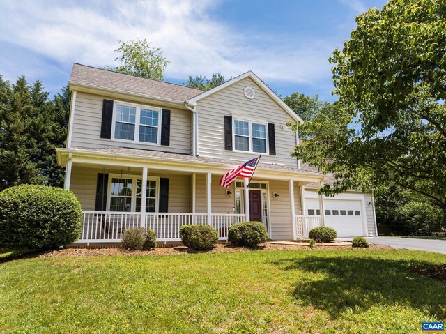5301 Little Fox Ln, Charlottesville, VA 22903 - traditional-style home featuring a porch, driveway, a front lawn, and a garage