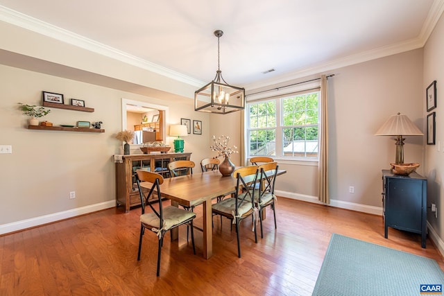 5301 Little Fox Ln, Charlottesville, VA 22903 - dining area featuring ornamental molding, a chandelier, light wood-style flooring, and baseboards