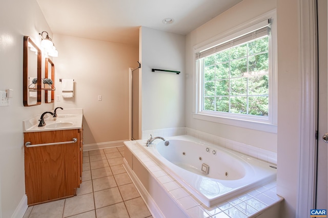 5301 Little Fox Ln, Charlottesville, VA 22903 - bathroom with vanity, a whirlpool tub, a shower stall, tile patterned flooring, and baseboards