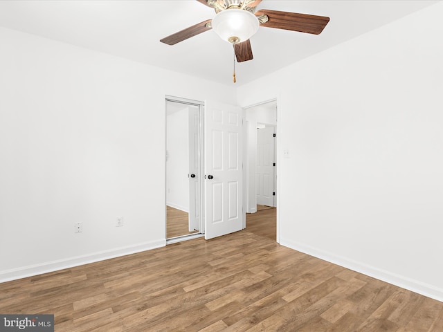 8475 Sexton Rd, Pasadena, MD 21122 - unfurnished room with wood finished floors, ceiling fan, and baseboards