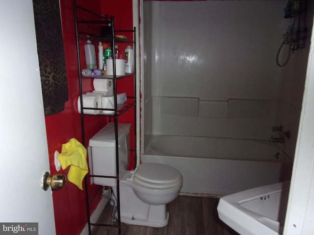 204 Hayward St, Cambridge, MD 21613 - full bathroom with toilet, wood finished floors, and shower / tub combination