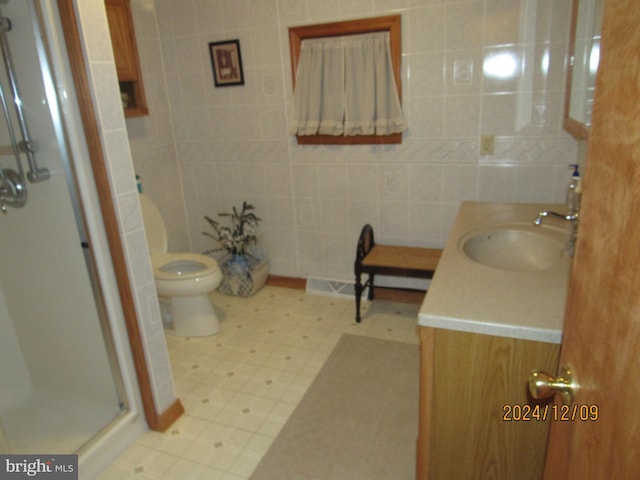 410 Pine Glen Rd, Moshannon, PA 16859 - bathroom with a shower stall, vanity, toilet, tile walls, and tile patterned floors
