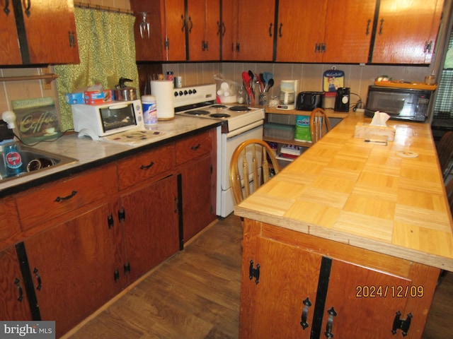 410 Pine Glen Rd, Moshannon, PA 16859 - kitchen with electric stove, butcher block counters, black microwave, decorative backsplash, and dark wood-type flooring