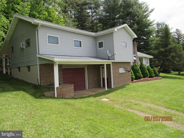 410 Pine Glen Rd, Moshannon, PA 16859 - view of front of house featuring a front yard, a garage, brick siding, and view of scattered trees