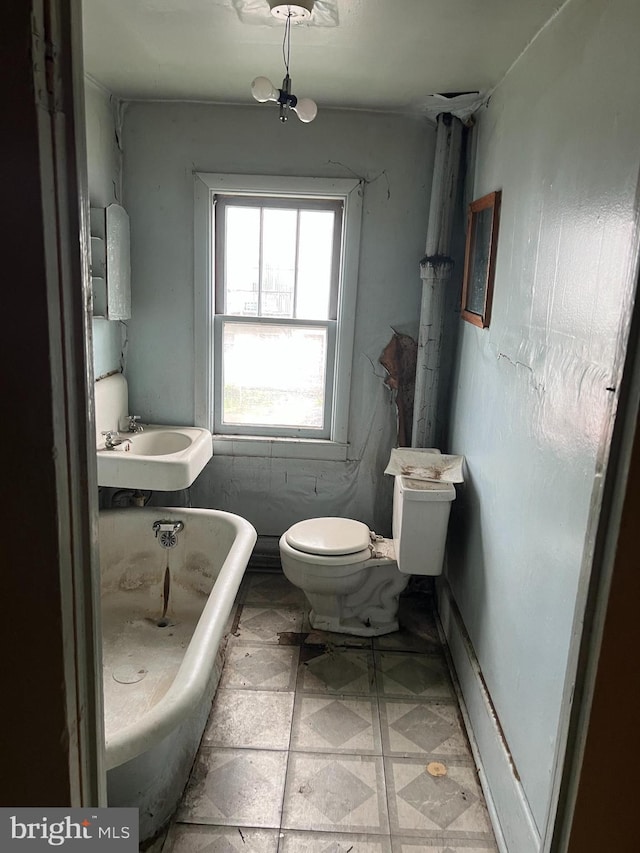 209 Blocker St, Ridgeley, WV 26753 - full bathroom featuring a freestanding tub, toilet, and a sink