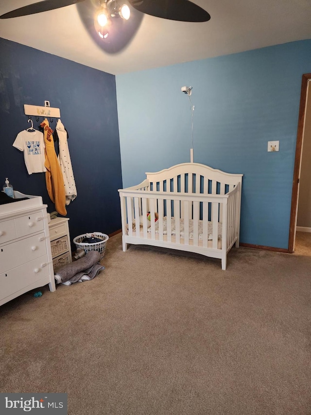 23 Maricopa Trl, Browns Mills, NJ 08015 - carpeted bedroom featuring a crib, baseboards, and ceiling fan