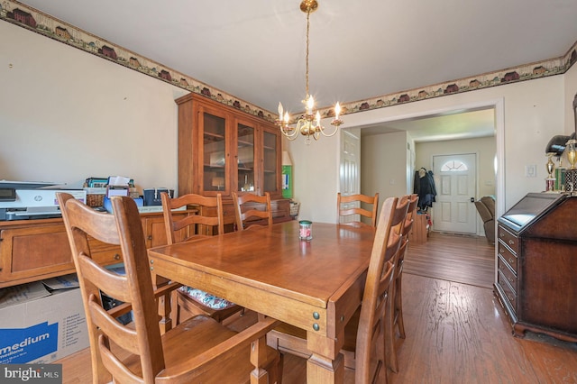 24519 Cedar Ln, Georgetown, DE 19947 - dining area with wood finished floors and a chandelier