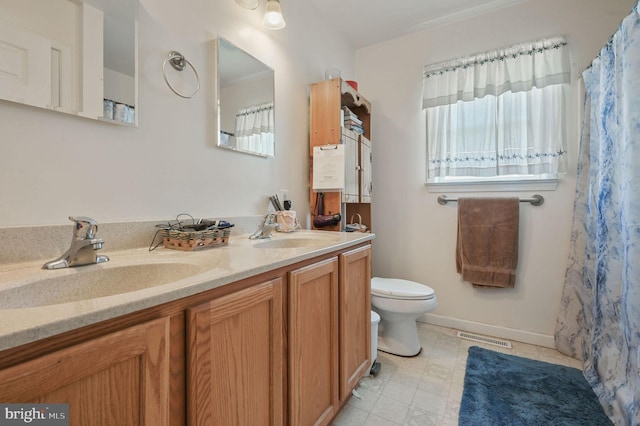 24519 Cedar Ln, Georgetown, DE 19947 - bathroom with double vanity and toilet