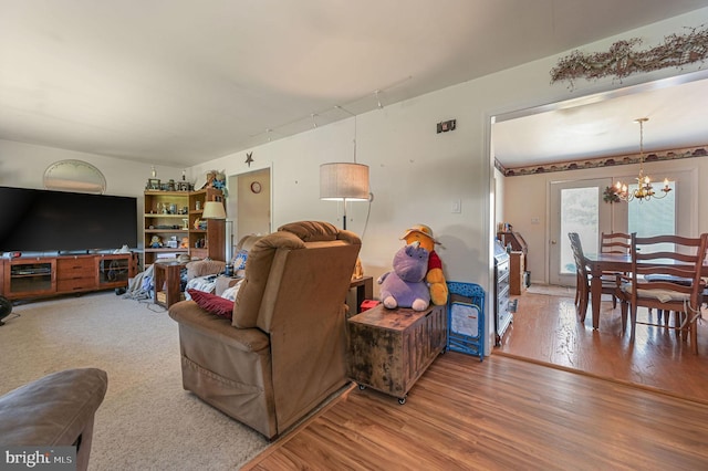 24519 Cedar Ln, Georgetown, DE 19947 - living room with a chandelier and wood finished floors