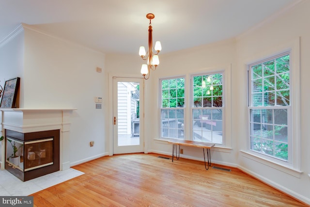 1201 Dartmouth Rd, Alexandria, VA 22314 - unfurnished living room featuring wood finished floors, plenty of natural light, baseboards, and crown molding