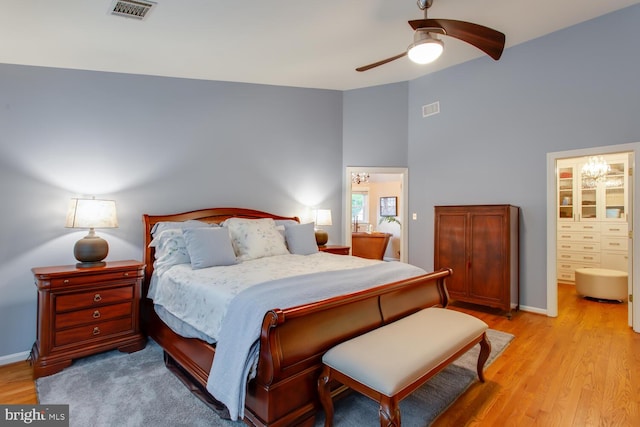 1201 Dartmouth Rd, Alexandria, VA 22314 - bedroom with light wood-style floors, baseboards, high vaulted ceiling, ensuite bath, and ceiling fan