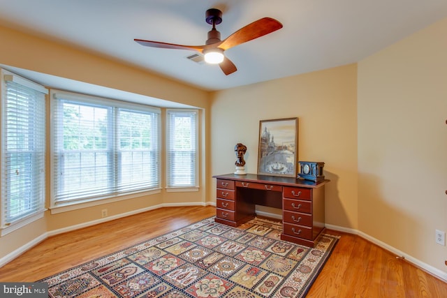 1201 Dartmouth Rd, Alexandria, VA 22314 - home office featuring light wood finished floors, ceiling fan, healthy amount of natural light, and baseboards