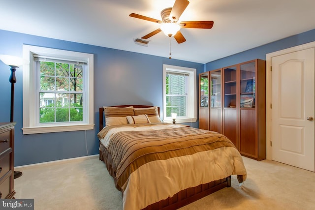 1201 Dartmouth Rd, Alexandria, VA 22314 - bedroom with light colored carpet, multiple windows, and a ceiling fan
