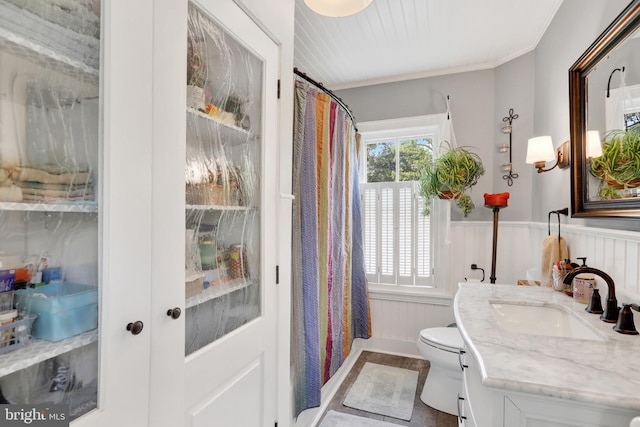 2538 Church Ln, Doylestown, PA 18902 - bathroom featuring toilet, vanity, wainscoting, a shower with shower curtain, and crown molding